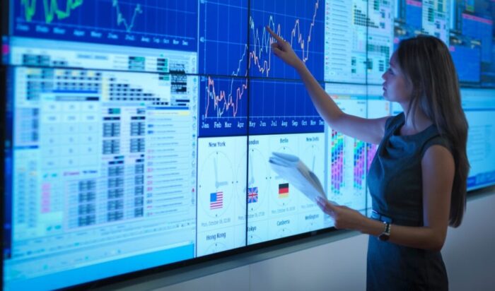 20 Nov 2013 --- Businesswoman preparing presentation on graphical screens --- Image by © Monty Rakusen/Corbis